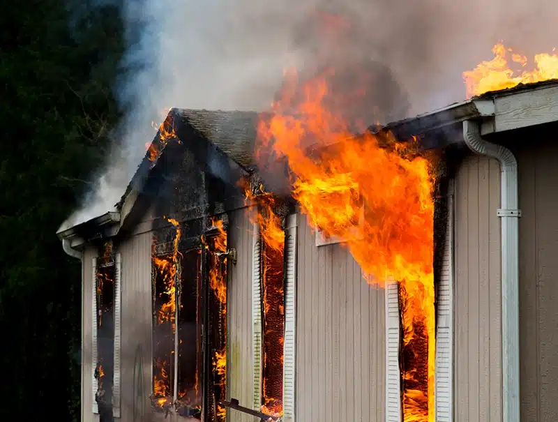 Residential house engulfed in flames with heavy smoke during a fire in Trumbull, Connecticut