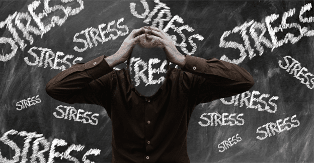 Person holding their head in frustration surrounded by the word “STRESS.”