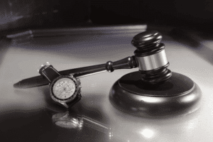Legal gavel and watch symbolizing timely action in bad faith insurance cases.
