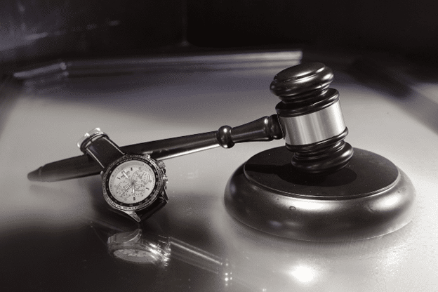 Legal gavel and watch symbolizing timely action in bad faith insurance cases.